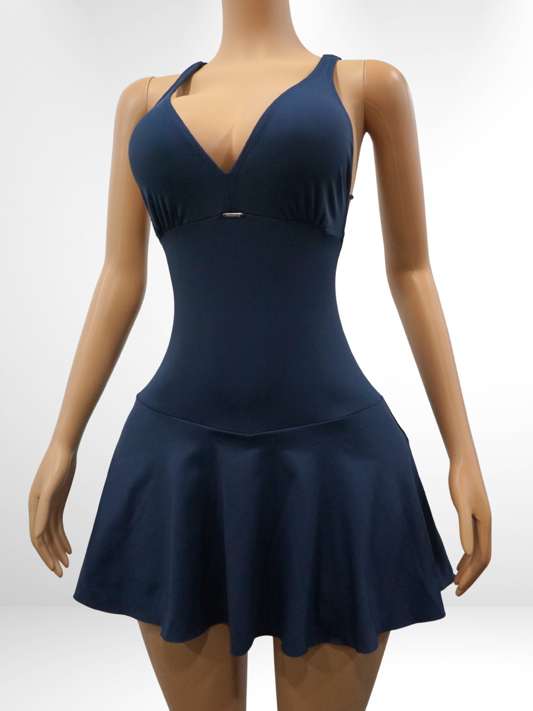 Navy blue dress on a mannequin against a white background