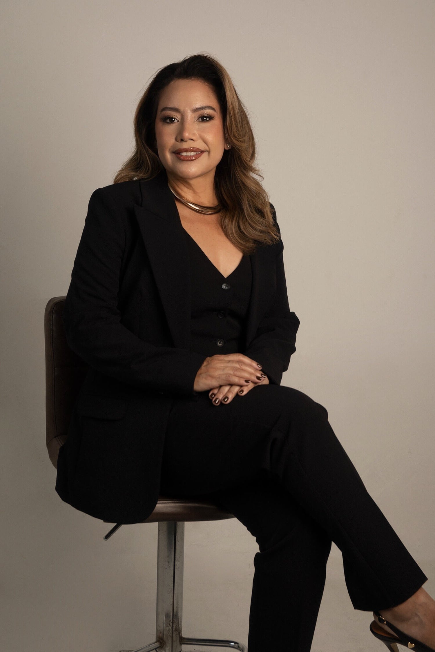 Ada Camejo founder of Sculpture Wear sustainable fashion brand professional portrait in black suit